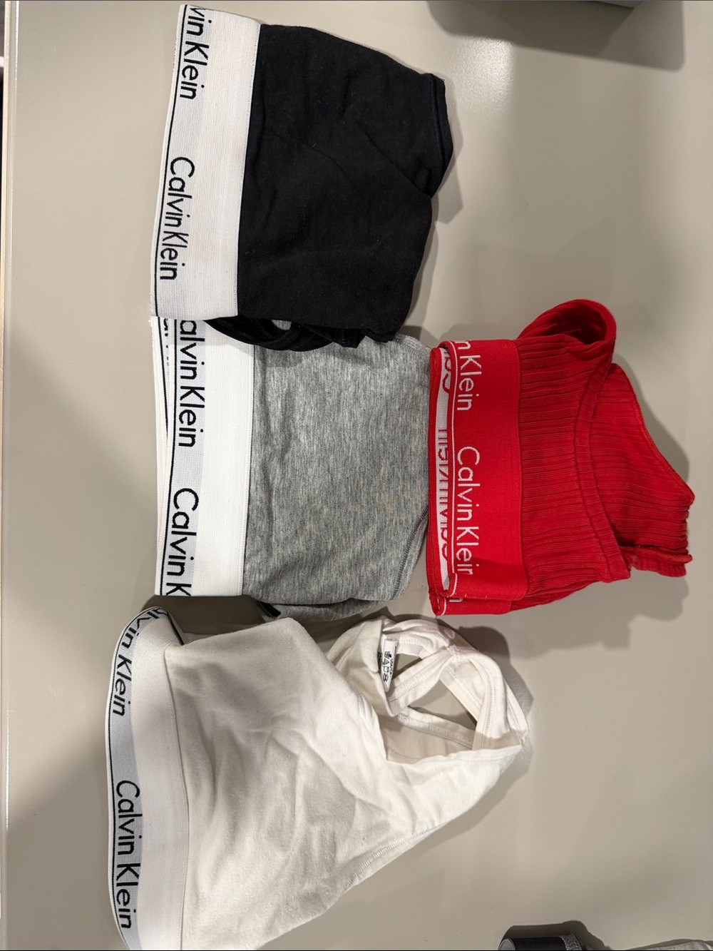 Calvin Klein 4-Pack Bralette Set in Black, Gray, White, Red